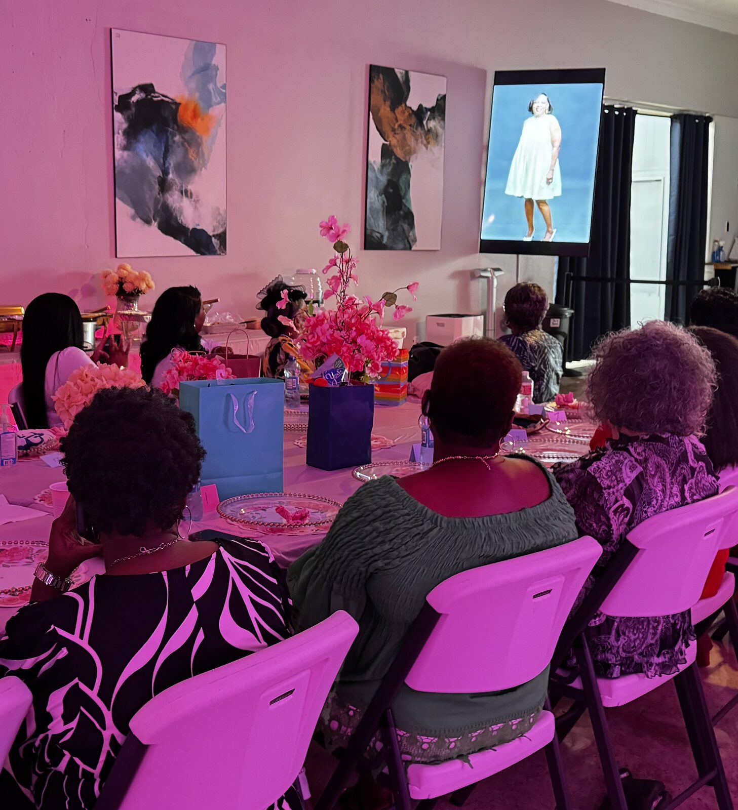 A photo slideshow playing on the 75-inch screens in the Atrium