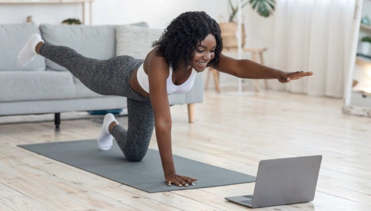 Streaming a fitness class on a phone and TV at home